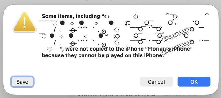Finder sync error message that shows that some of the files from Four Tet's Wingdings alias cannot be copied to the iPhone, "because they cannot be played on this iPhone" (which is wrong, of course)