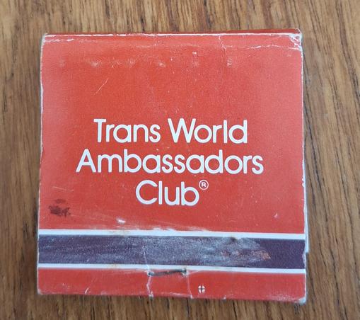 A matchbook with the words "Trans World Ambassadors Club" printed on it. In very small text, not visible, are the words "Universal Match, Kansas City". Delicious!