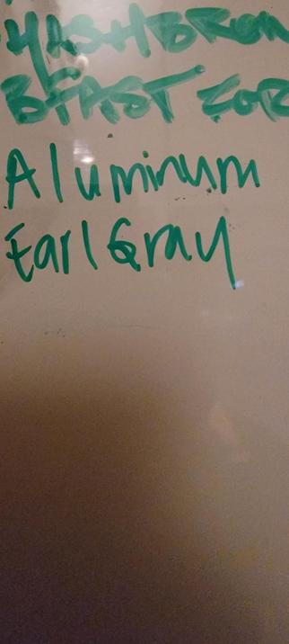 Fragment of a whiteboard list that says Aluminum Earl Gray