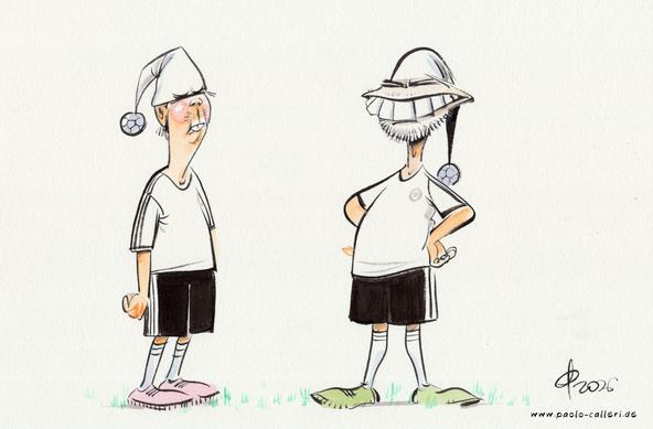 Karikatur "Fußballdeutschland" aus dem Jahr 2026. Zwei Männer in schwarzßweißfarbenem Deutschlandtrikot stehen sich gegenüber. Sie tragen beide eine weiße Zipfelmütze mit einem kleinen Fußball als Bommel.