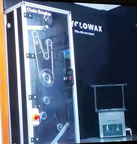A Tour de France professional team chain waxing station, with machine to  break the chains in after waxing.