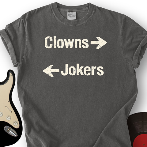 T-shirt with the text:

Clowns →

← Jokers

which is a reference to the Stealer's Wheel 1970s Dylanesque pop bubblegum favorite, "Stuck in the Middle with You"