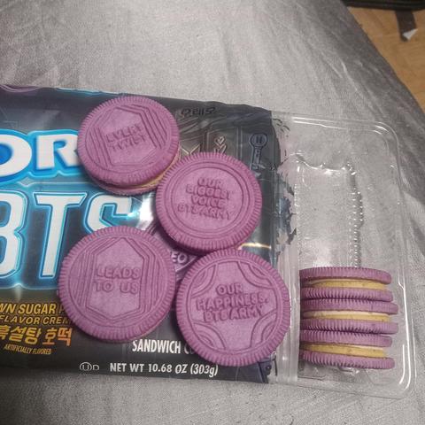 Purple oreos with saying
"Every twist" "leads to us"
Bts army is happiness etc.

Two color filling white and brown sugar.