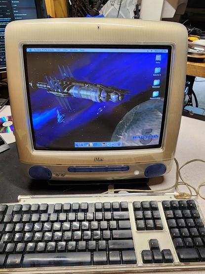 An iMac G3 with a Babylon 5 wallpaper