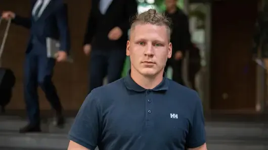 Neo-Nazi wearing a Helly Hansen polo with a prominent "HH" logo