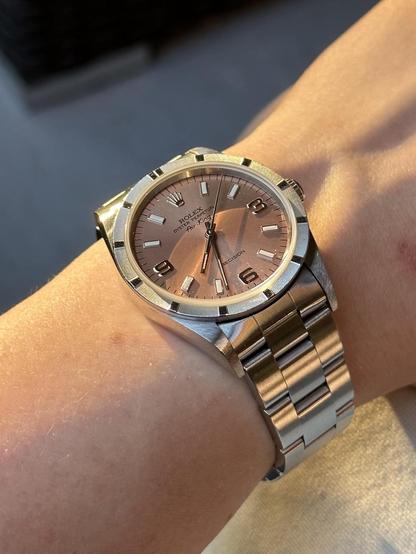 Wrist shot of a Rolex 14010 with harsh sun light at dusk.