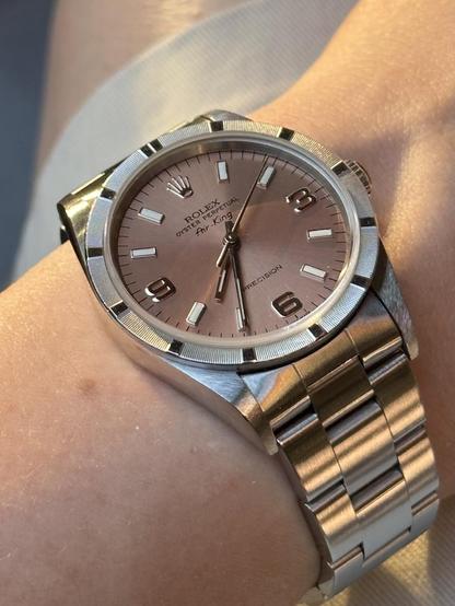 Wrist shot of a Rolex 14010 with moderate sun light at dusk.