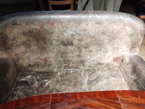Coach decorated with a world map