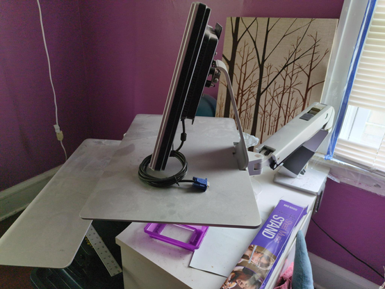 The same ergotron swingarm, but viewed from the side so you can see the table mount.