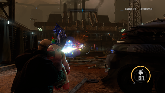 A man wearing goggles wielding a unicorn, which is firing a rainbow laser from its behind with a shocked expression on its face.