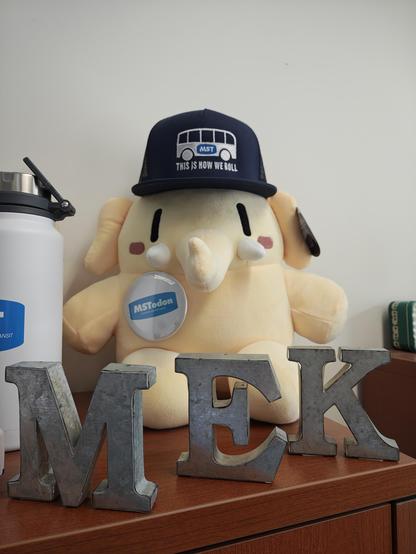 Yellow Mastodon plush toy, wearing a Monterey-Salinas Transit baseball cap and a button that says "Mastodon"

July 6, 2026