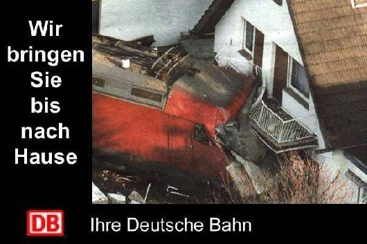 A derailed train that ended up in the front of as building