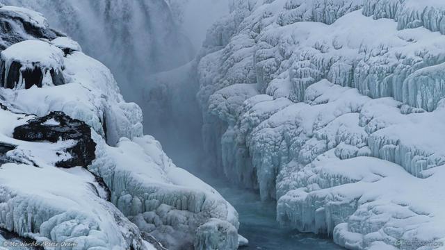 The second colour photo is of the icicles and cakes of ice at the point on the canyon wall next to the top falls. The ice is quite turquoise due to the fact that it's constantly wet. Snow has settled on the upper surfaces of the icicles. Some black rock is showing through in a few places, but mostly the ice is dominant. Running water can be seen at the top left.