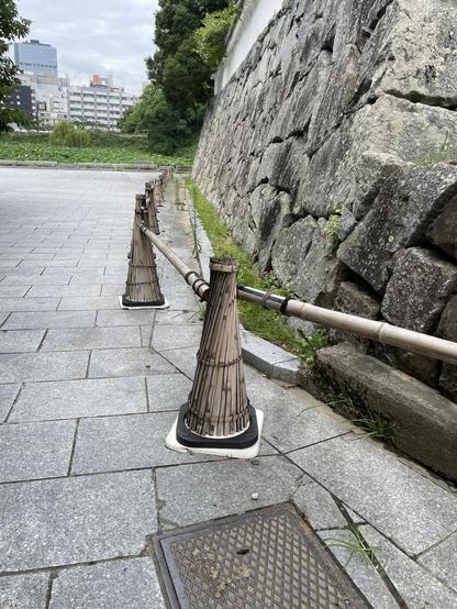 White cones covered in bamboo, to blend in with the castle architecture