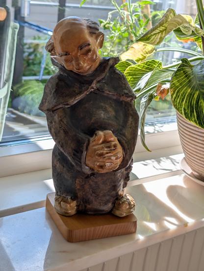 An ornamental figure of an old, bold, fat monck