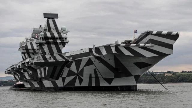 A WW1 warship with dazzle camouflage, bold irregular stripes to make it more challenging for enemy submarines to be able to see the shape, speed and direction of vessels especially in a convoy