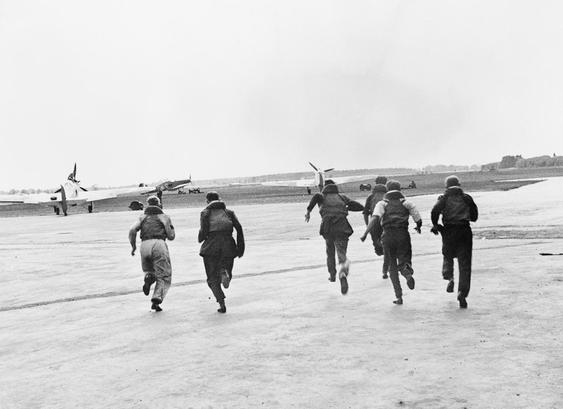 “RAF Pilots seen running to their aircraft.”

credit Official photographer - This photograph HU 49253 comes from the collections of the Imperial War Museums.

source https://en.wikipedia.org/wiki/Battle_of_Britain#/media/File:Pilot_seen_running_to_fighter.jpg