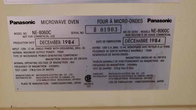 Rear label of the Panasonic Genius microwave oven. It's a model NE-8060C made December 1984. It lists an output power of 700 watts, and it was made in Japan.