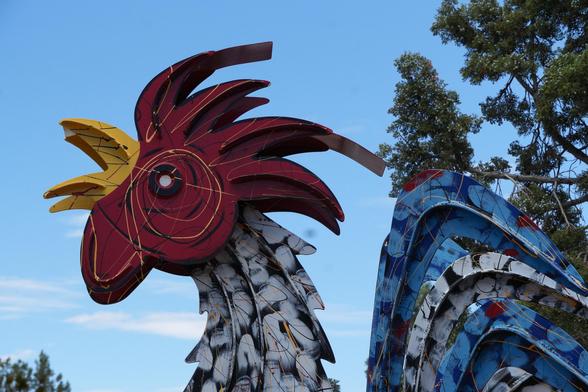 A metal sculpture of a rooster