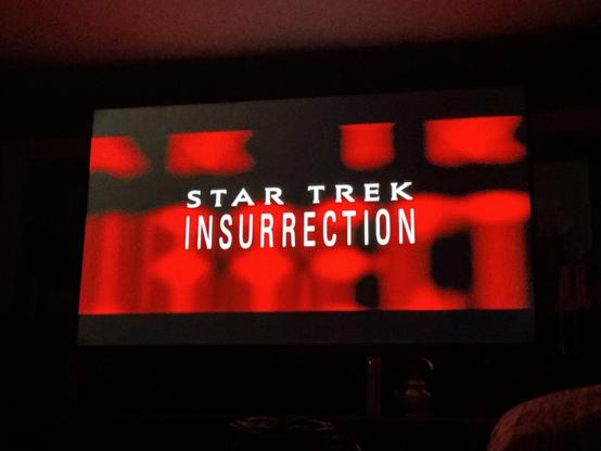 STAR TREK
INSURRECTION
The opening credit shows the words on a black background with the same words in red behind but zoomed in until they match.