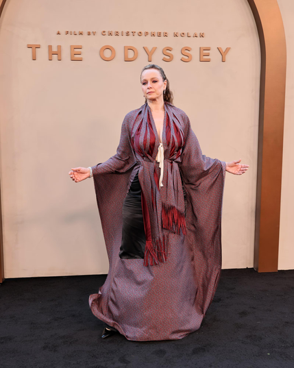 Samantha Morton in Maison Margiella, a mauve robe-like dress with flowing sleeves that attach to the skirt and dark red details