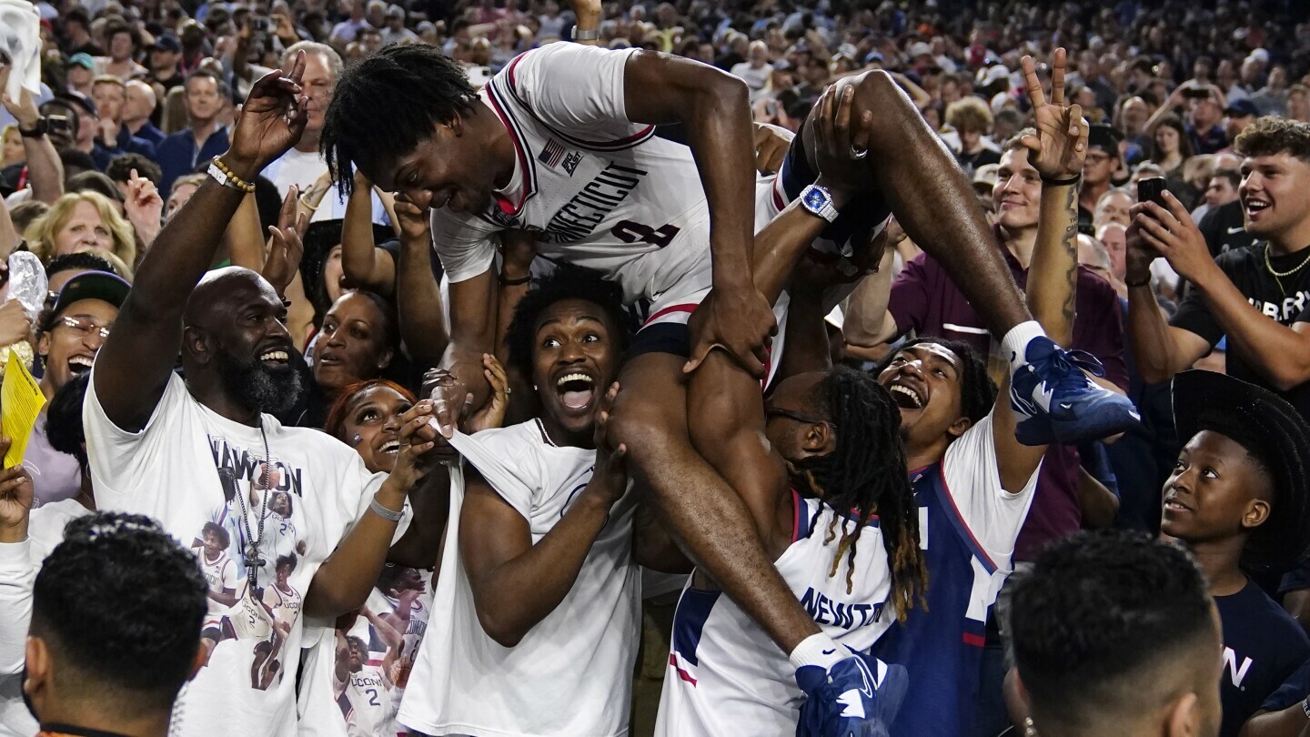 Connecticut guard Tristen Newton celebrates after their win against San Diego State during the men's national championship college basketball game in the NCAA Tournament on Monday, April 3, 2023, in Houston. (AP Photo/Brynn Anderson)