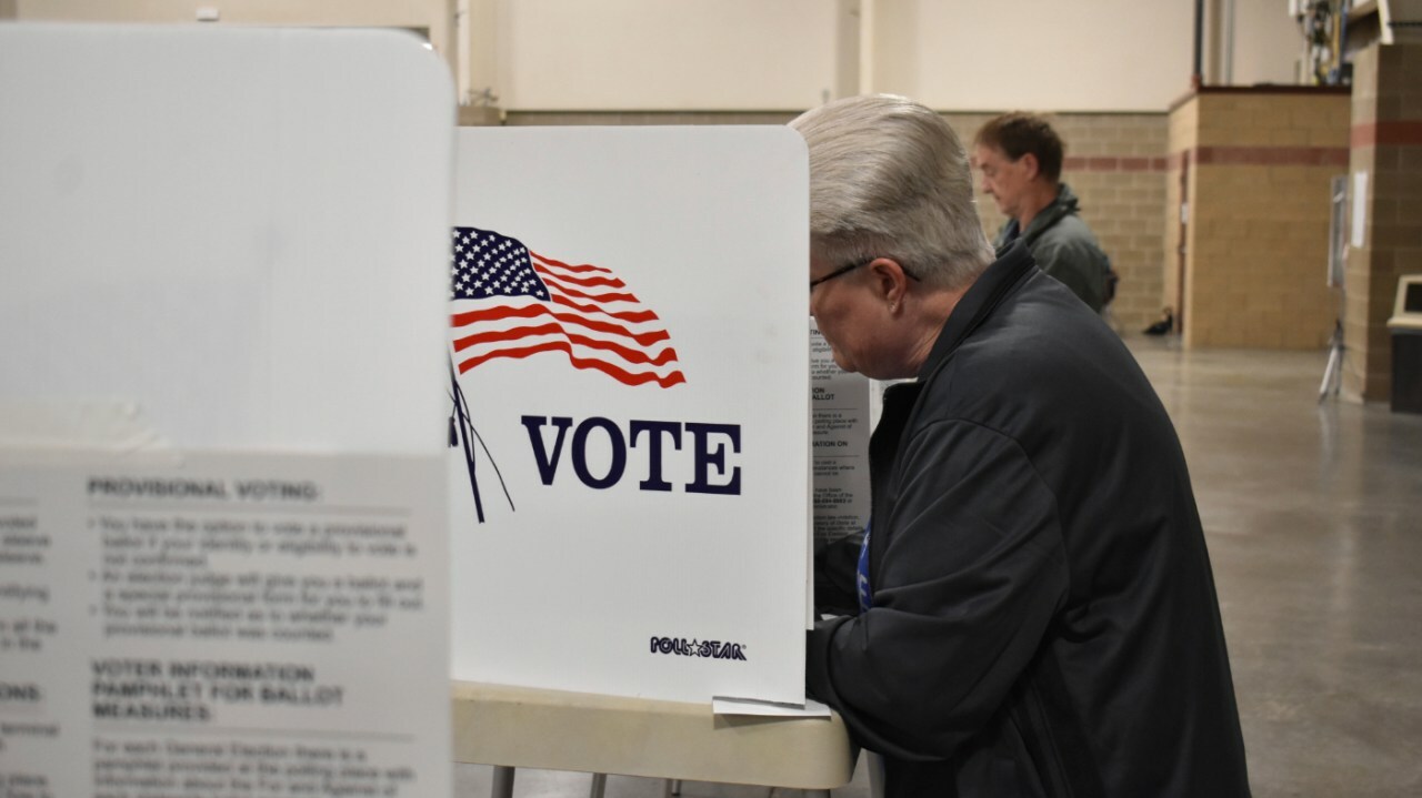 A voter fills out a ballot at the MetraPark events center, Tuesday, June 4, 2024, in Billings, Mont. The primary election will lock in a Republican candidate to challenge three-term incumbent Democratic U.S. Sen. Jon Tester in the November general election. (AP Photo/Matthew Brown)
