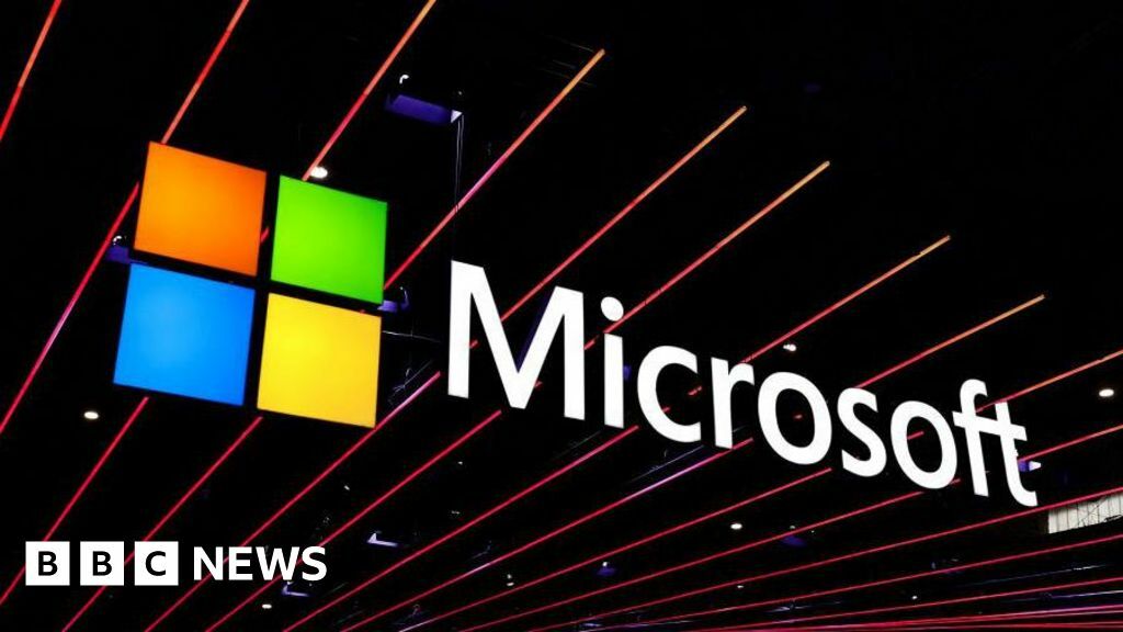 A Microsoft logo displayed against black beams