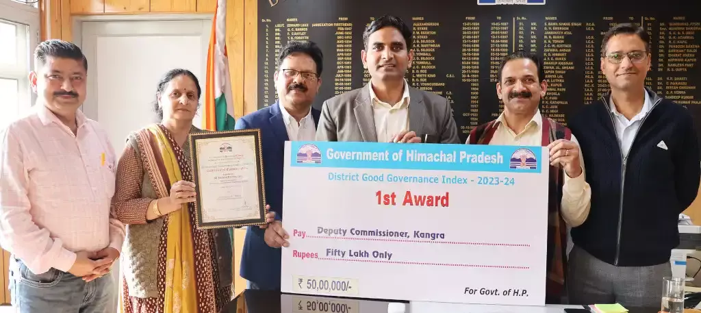 Deputy Commissioner Hemraj Bairwa and team proudly displaying prestigious Good Governance Award.