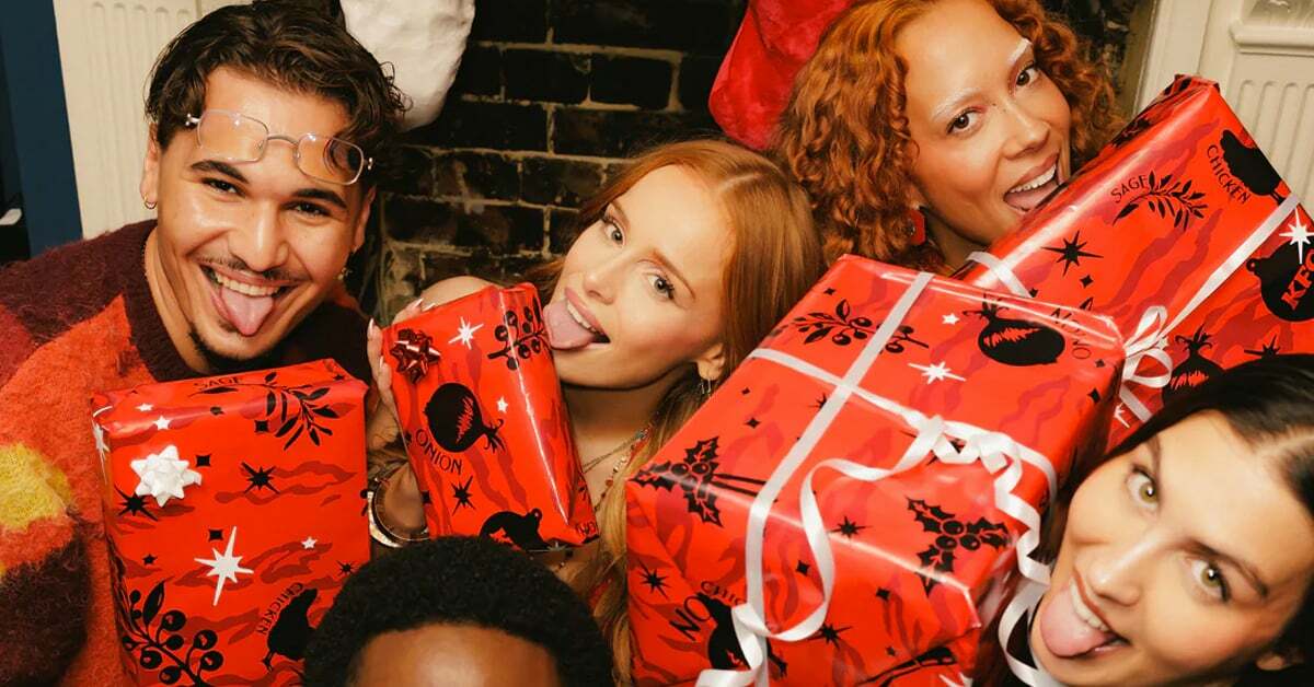 A group of friends holding gifts covered in KFC's lickable wrapping paper | ©Image Credit: KFC