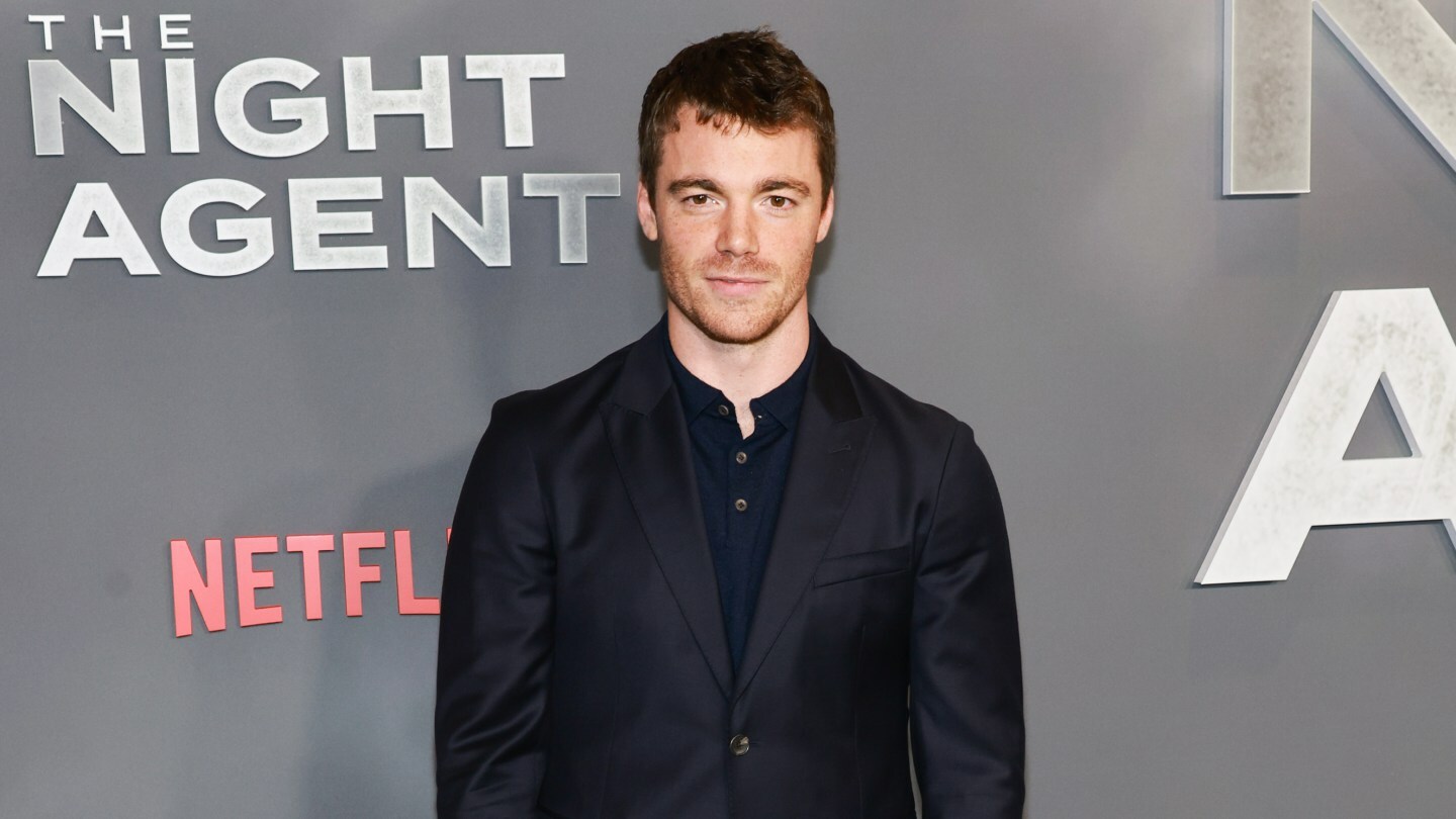 Gabriel Basso poses at the premiere of Netflix's The Night Agent.