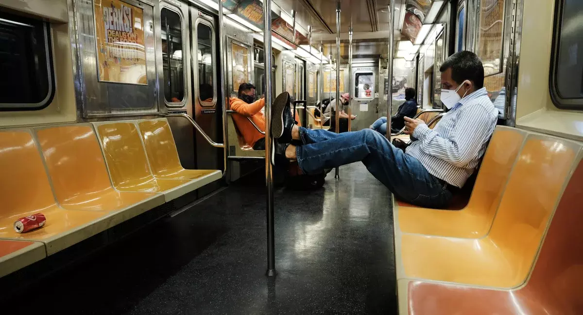 Man riding the NYC subway in 2021.
