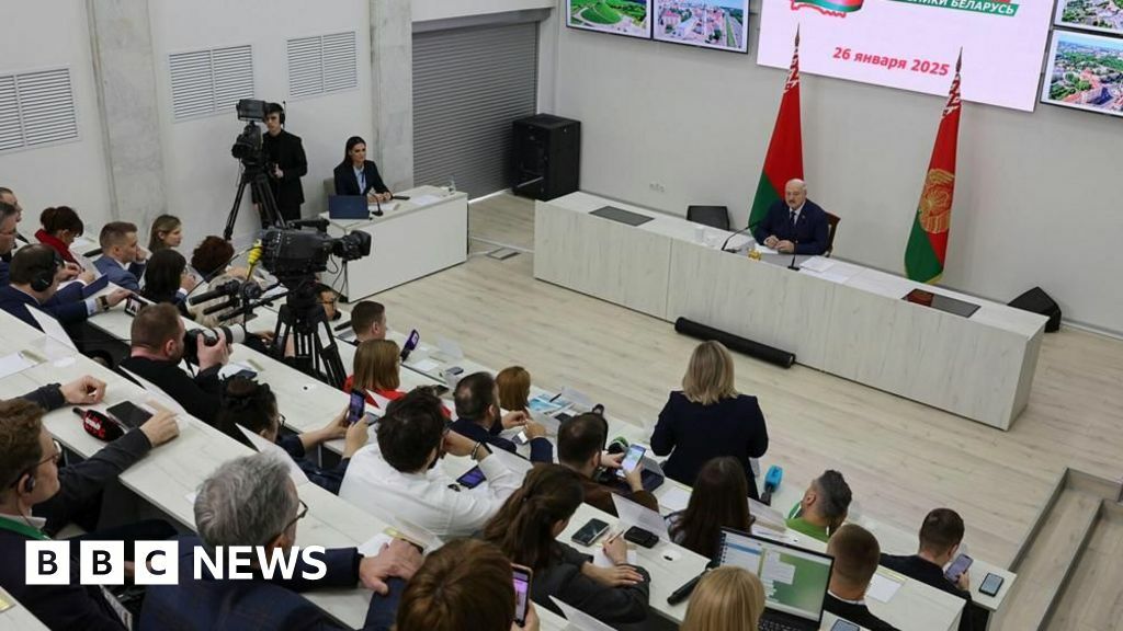 A handout picture made available by Belarus President press service shows Belarusian President Alexander Lukashenko (R) attending a press conference after casting his ballot in the presidential elections at a polling station in Minsk, Belarus, 26 January 2025