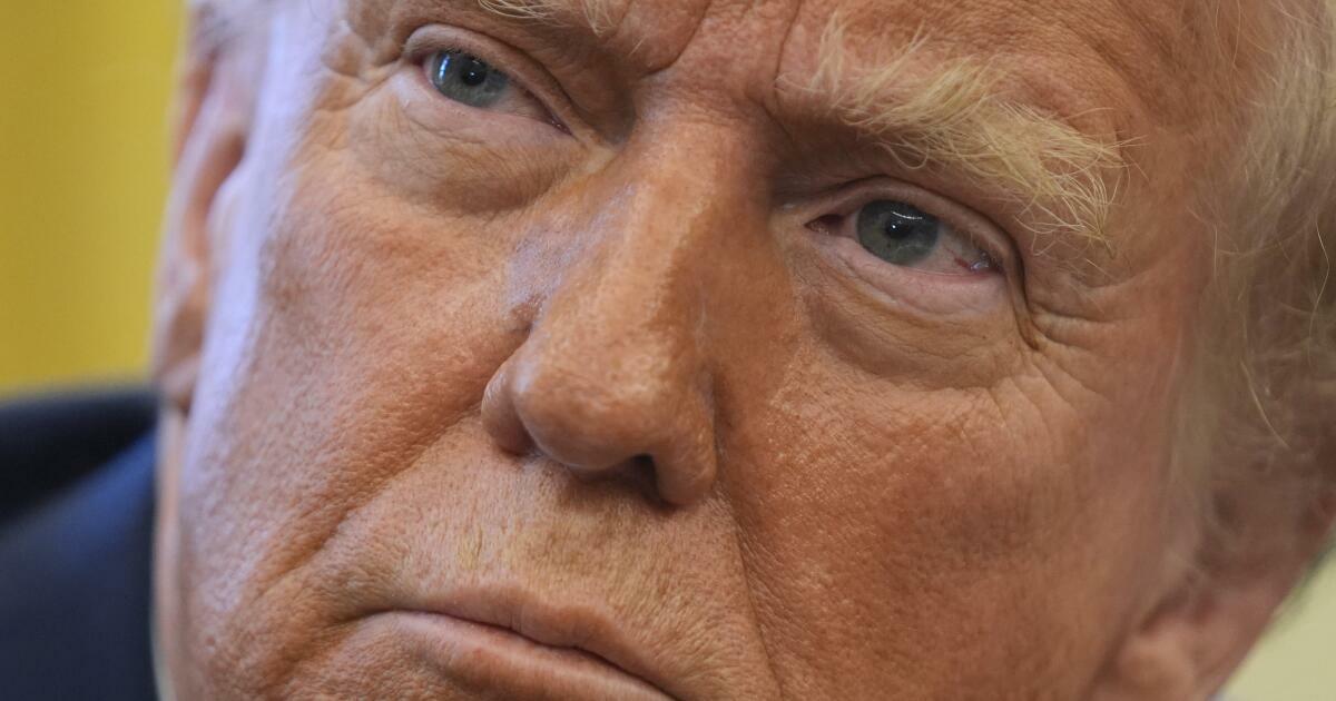 President Donald Trump listens to a question as he signs executive orders in the Oval Office at the White House, Thursday, Jan. 30, 2025, in Washington. (AP Photo/Evan Vucci)