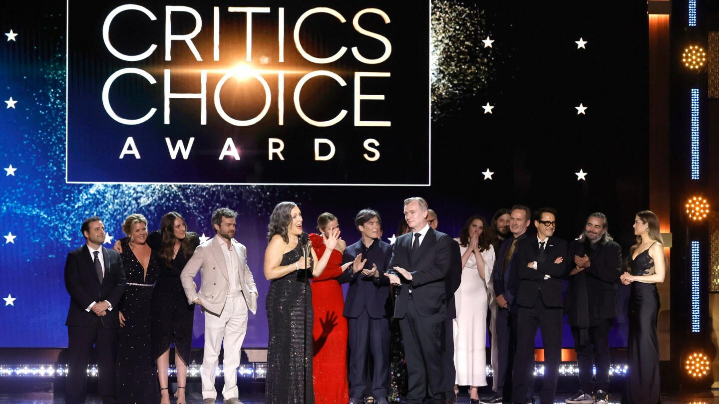David Krumholtz, Claire Kaufman, Ruth De Jong, Alden Ehrenreich, Emma Thomas, Emily Blunt, Cillian Murphy and Christopher Nolan accept the Best Picture Award for 'Oppenheimer' at 29th Annual Critics Choice Awards in 2024.