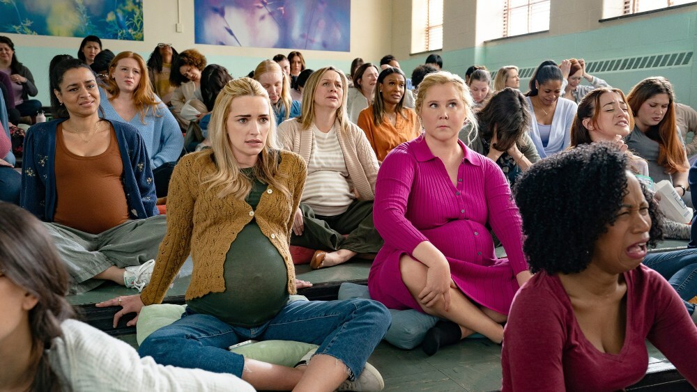 KINDA PREGNANT, center, from left: Brianne Howey, Amy Schumer, 2025. ph: Scott Yamano / © Netflix / Courtesy Everett Collection KINDA PREGNANT, center, from left: Brianne Howey, Amy Schumer, 2025. ph: Scott Yamano / © Netflix / Courtesy Everett Collection