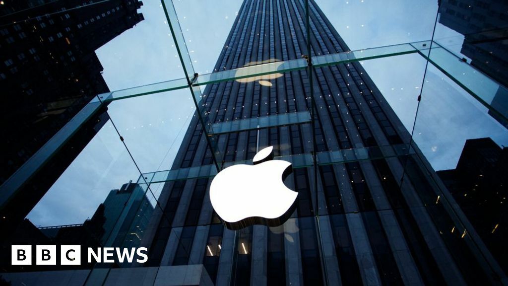 Apple's logo shown on its glass store front in New York.