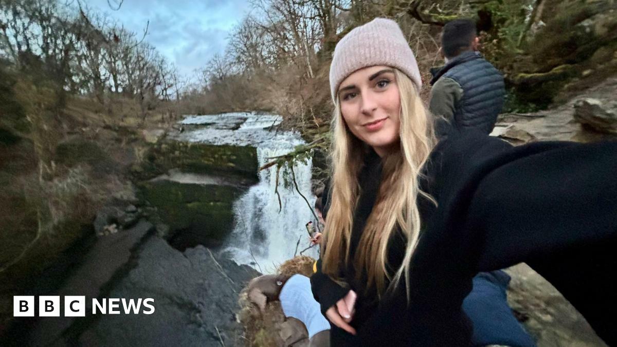 Chelsea can be seen out walking in front of a stream.