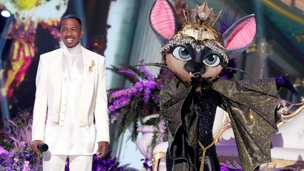 THE MASKED SINGER: L-R Nick Cannon and Bat in the THE MASKED SINGER episode “Voices of Olympus” airing Wednesday, March 5 (8:00-9:02 PM ET/PT) on FOX. CR: Michael Becker. ©2025 FOX Media LLC.