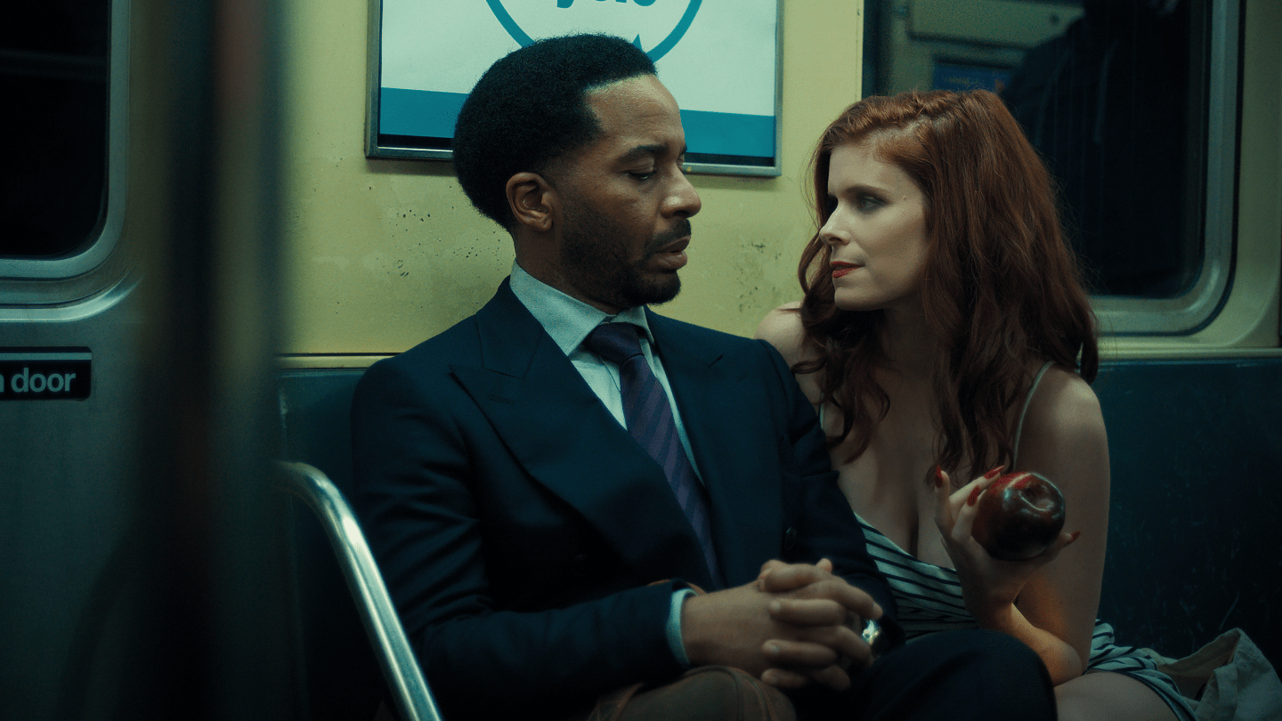 André Holland and Kate Mara sitting in a train car in 'The Dutchman'