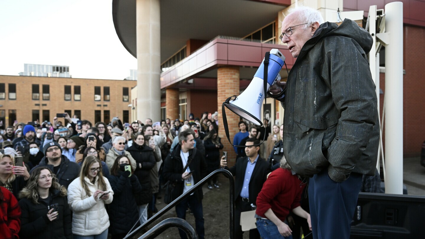 Sen. Bernie Sanders, I-Vt., right, speaks to an overflow crowd outside Lincoln High School as he talks about "Fighting Oligarchy: Where We Go From Here", Saturday, March 8, 2025, in Warren, Mich. (AP Photo/Jose Juarez)