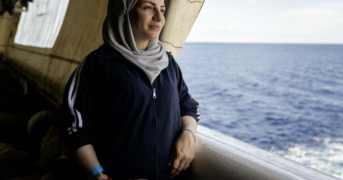 A Syrian woman, seven-month's pregnant, looks out at the Mediterranean Sea from the stern of the Geo Barents, September 20, 2024.