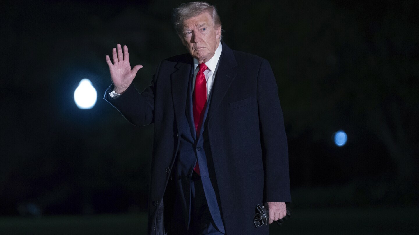 President Donald Trump gestures to reporters as he walks on the South Lawn of the White House in Washington, Sunday, April 13, 2025. (AP Photo/Jose Luis Magana)