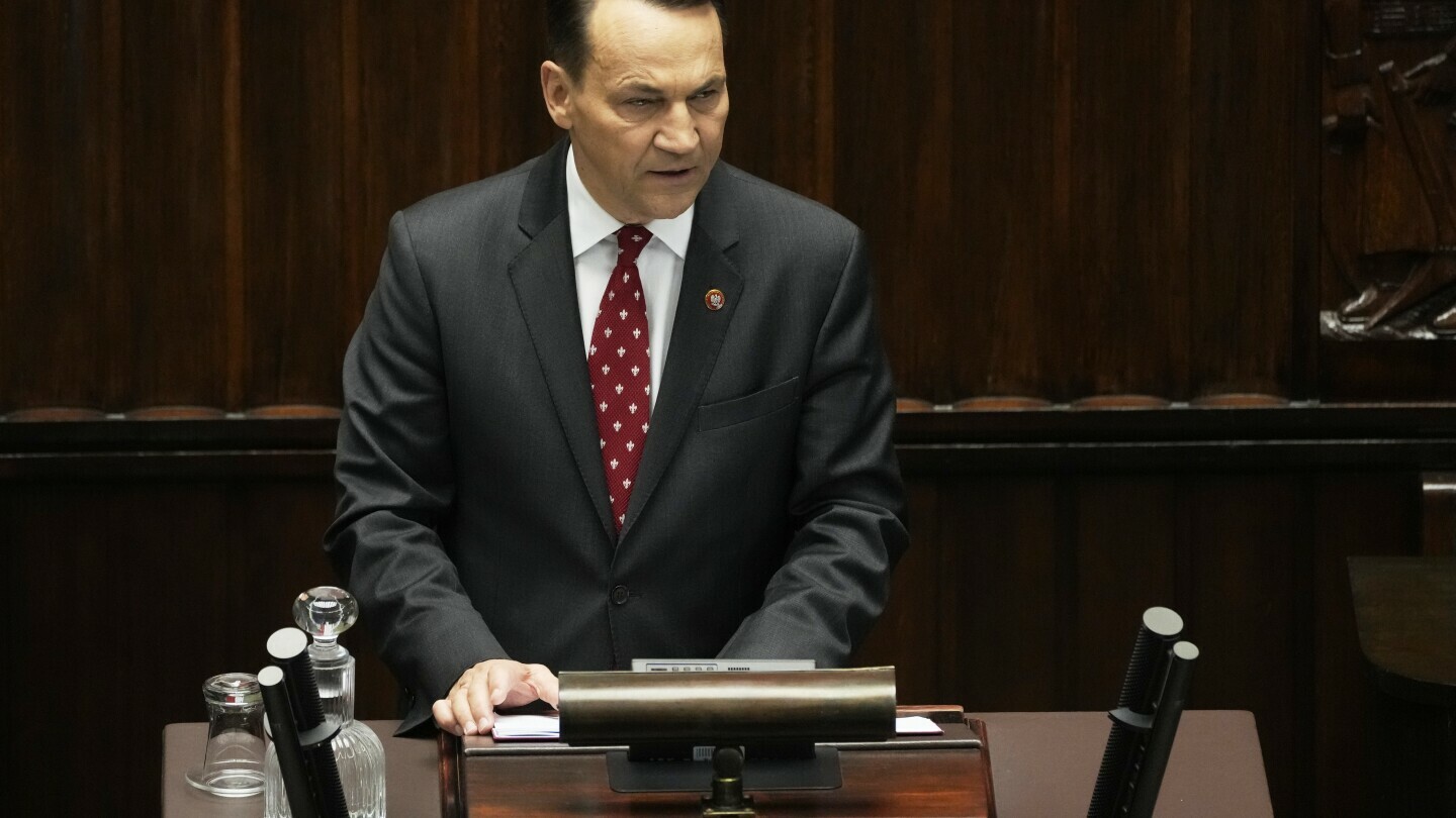 Poland's Foreign Minister Radek Sikorski gives a speech at the parliament on Wednesday, April 23, 2025, in Warsaw, Poland. (AP Photo/Czarek Sokolowski)