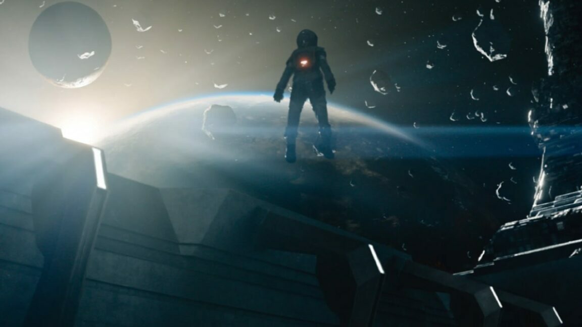 still from Apple TV + series Foundation, showing an astronaut standing on a planet, space debris swimming around, while looking at a distant moon.