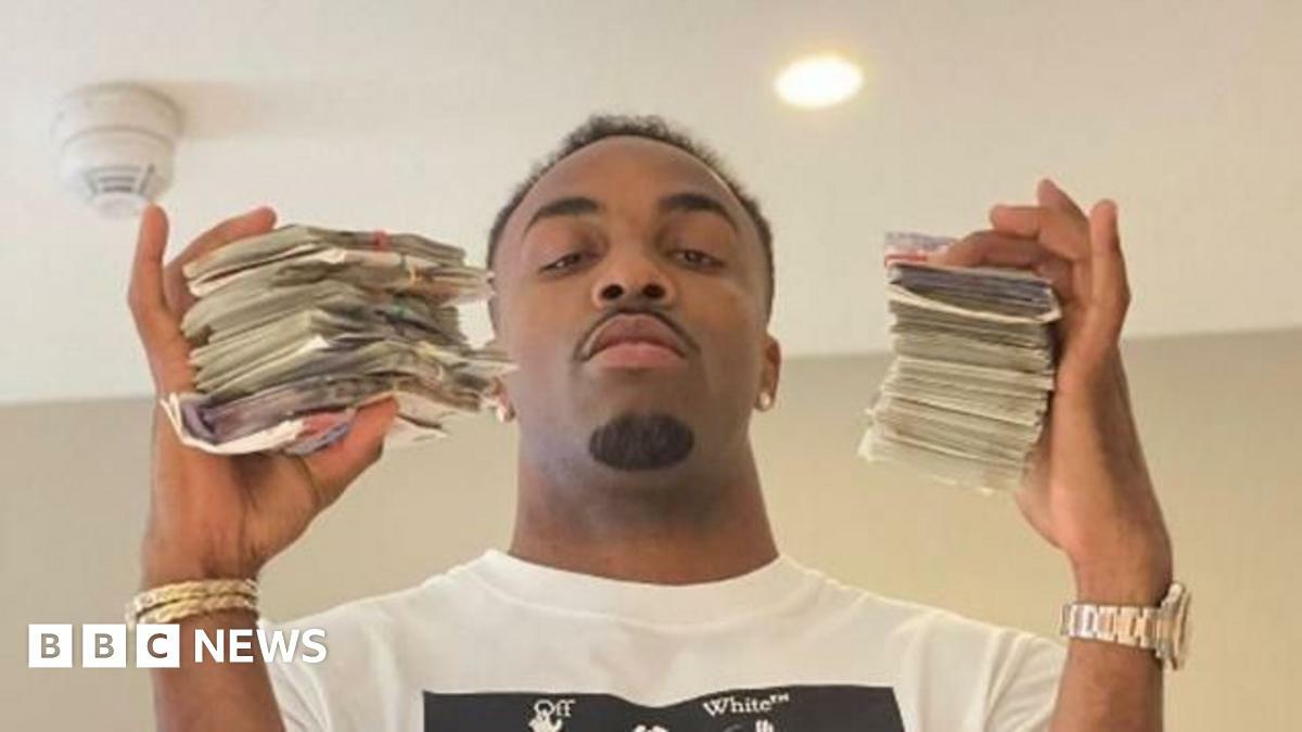 Davante James is holding wads of cash Davante James is holding wads of cash