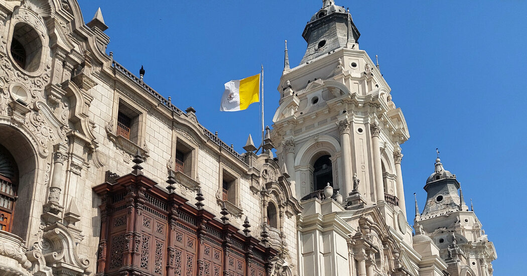 The Vatican’s flag fluttering at the Metropolitan Cathedral in Lima, Peru after Cardinal Robert Francis Prevost was elected pontiff on the second day of the conclave on Thursday.