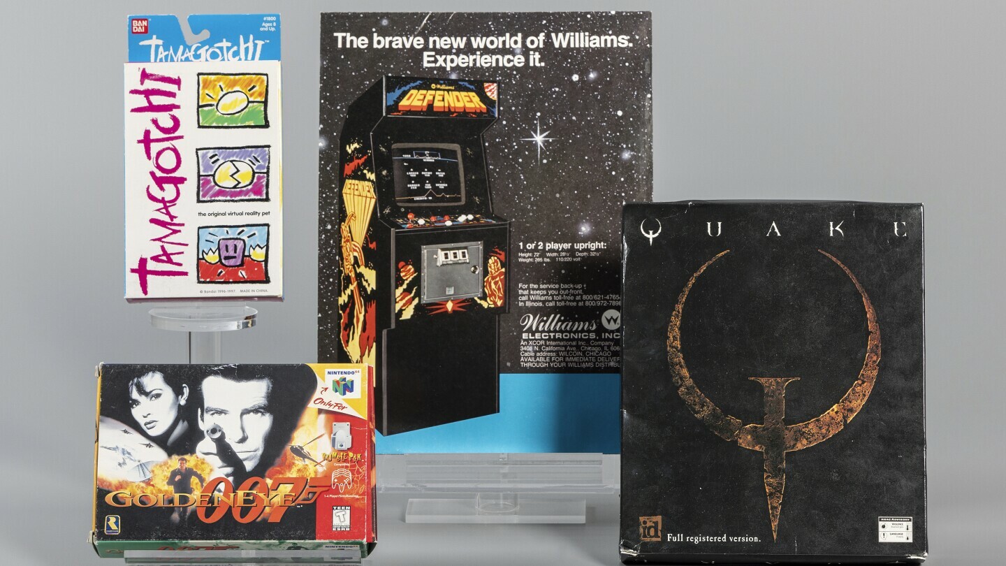 This photo, provided by The Strong Museum in Rochester, N.Y., shows "Defender", "GoldenEye 007", "Quake", and "Tamagotchi", the newest inductees into the World Video Game Hall of Fame. (The Strong Museum via AP)
