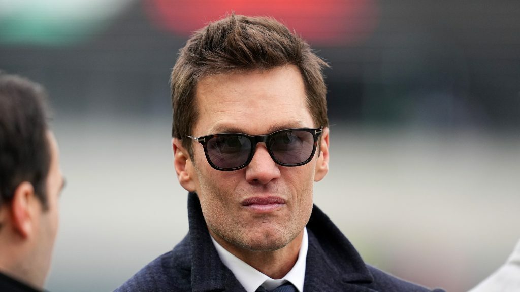 Tom Brady wears sunglasses.