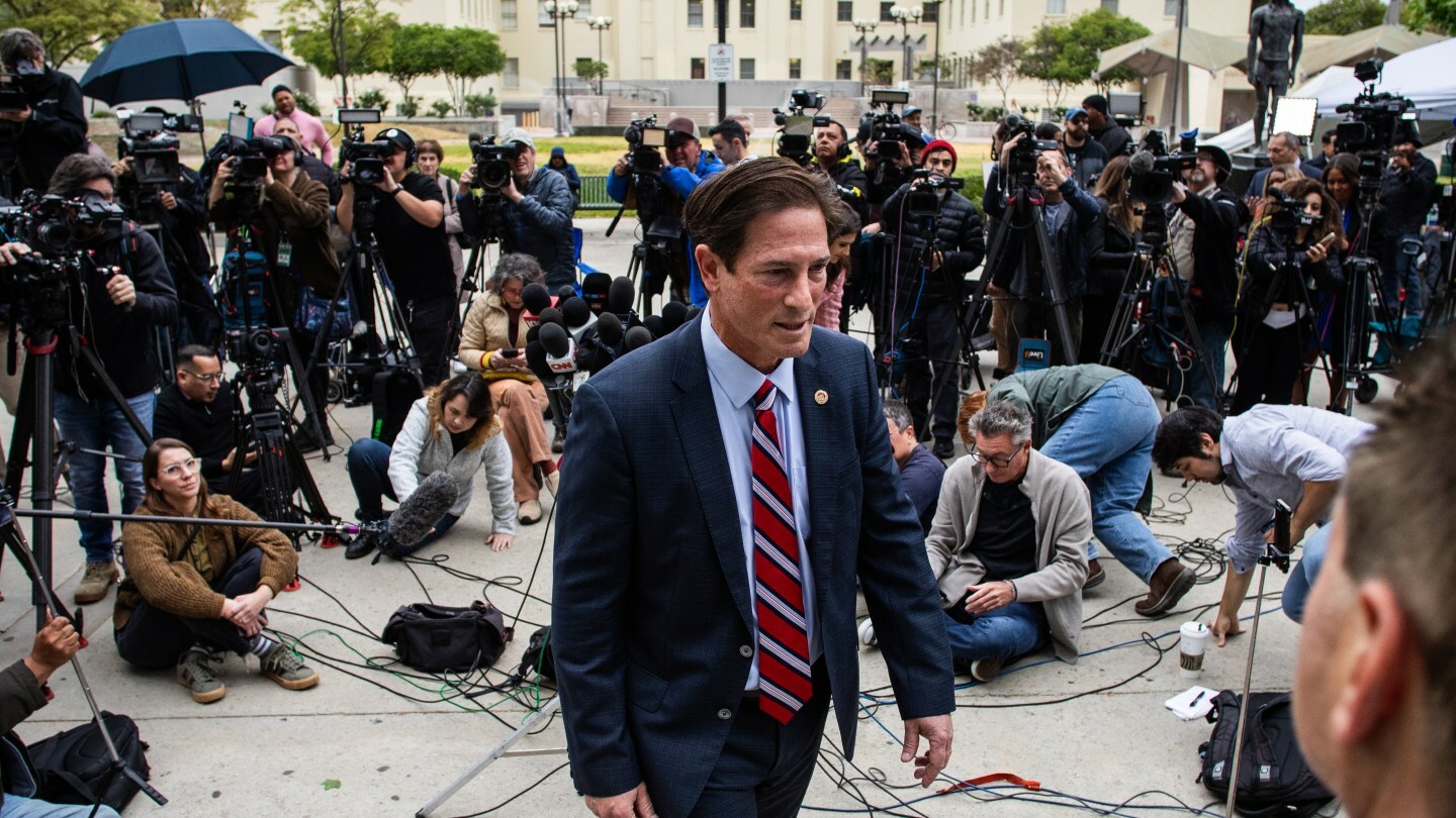 The Los Angeles County District Attorney Nathan J. Hochman leaves after talking to the press in front of the Van Nuys West Courthouse before attending to a resentencing hearing for Lyle and Erik Menendez as part of a process that could eventually lead to the brothers' release from prison, on April 17, 2025 in Van Nuys, California.